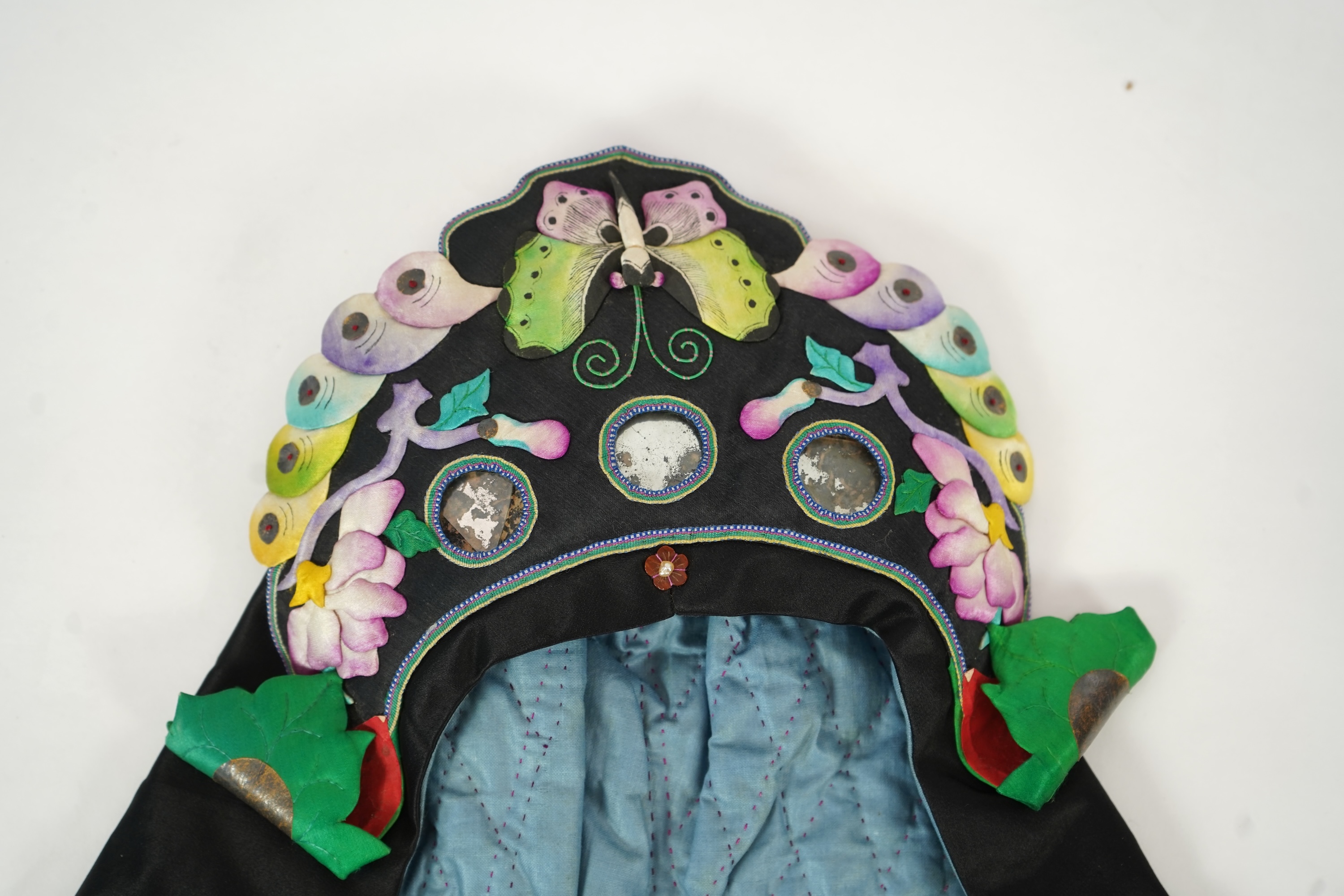 Two Chinese embroidered silk wedding skirts, late Qing, five hats, trousers, two skirt panels and two others, collar and a panel